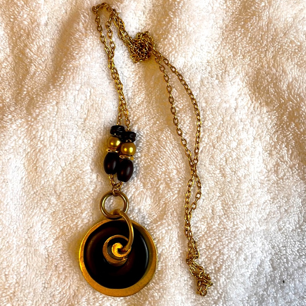 NWOT Gold necklace with pendant and black and gold beads.